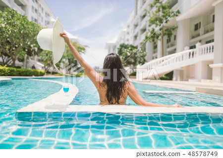 Asian woman in bikini and hat Asian woman in bikini and hat 48578749