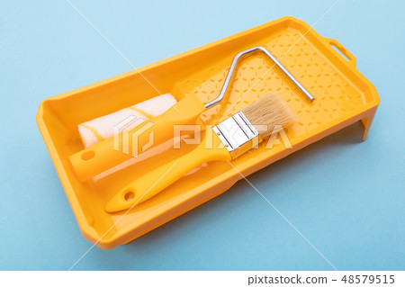 Paint tools. Paint brush and roller with tray for paint. Mock-up Paint tools. Paint brush and roller with tray for paint. Mock-up 48579515