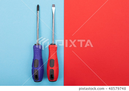 Plastic set of screw-drivers isolated on colorful background 48579748