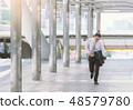 businessman in a hurry and running, he is late 48579780