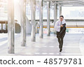 businessman in a hurry and running, he is late 48579781
