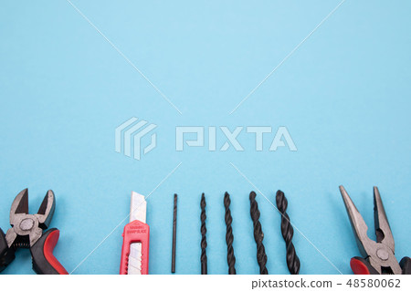 Set of different tools on blue background Set of different tools on blue background 48580062
