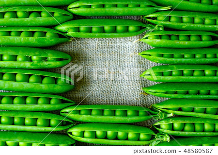 Fresh green peas vegetable background. 48580587