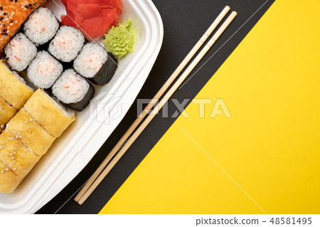 Top view on sushi set at colored background. Top view on sushi set at colored background. 48581495