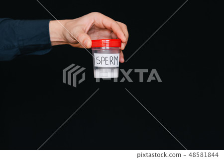 bank of sperm in a male donor hand for analysis bank of sperm in a male donor hand for analysis 48581844