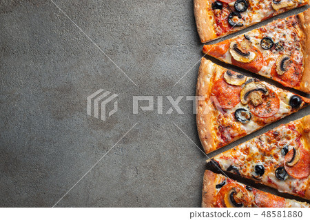 Slices of pepperoni pizza with mushrooms. Slices of pepperoni pizza with mushrooms. 48581880