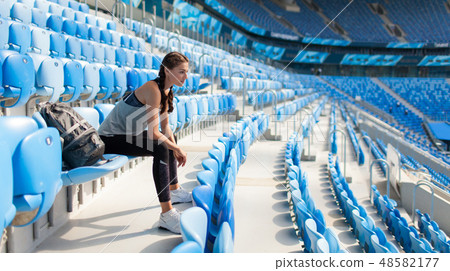 Sexy girl posing at stadium. Sexy girl posing at stadium. 48582177