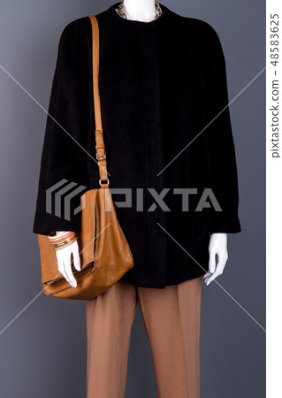 Mannequin in stylish clothes, grey background. 48583625