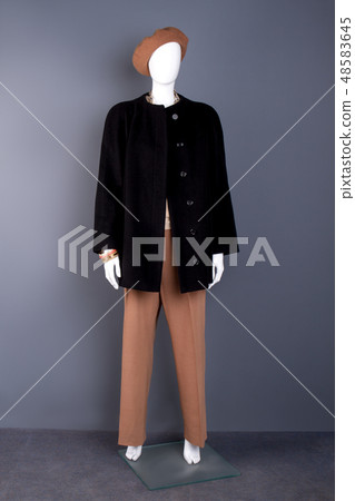Full length female mannequin in modern apparel. Full length female mannequin in modern apparel. 48583645
