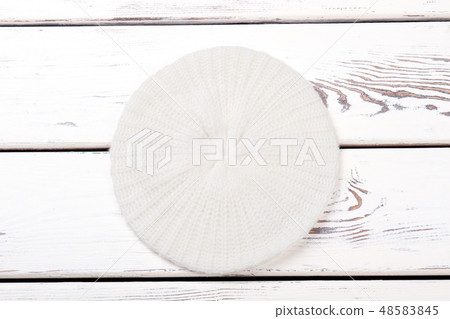 White knitted beret for women. 48583845