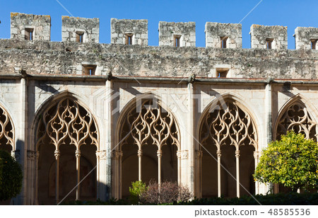 Gothic ogival windows in cloister of Monastery of Santa Maria de Santes Creus 48585536