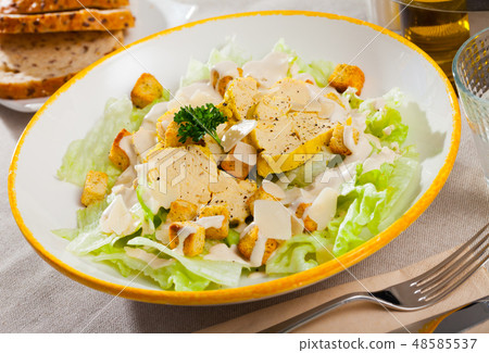 Caesar salad with chicken 48585537