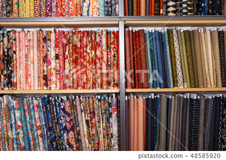 Fabric bolts on shop shelves 48585920