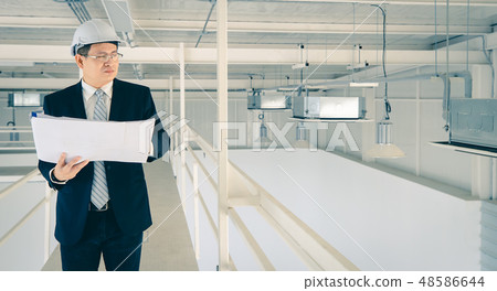 Asian engineer using tablet in industrial factory. 48586644