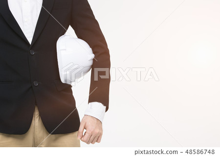 Portrait of engineer, helmet in his arm.. 48586748