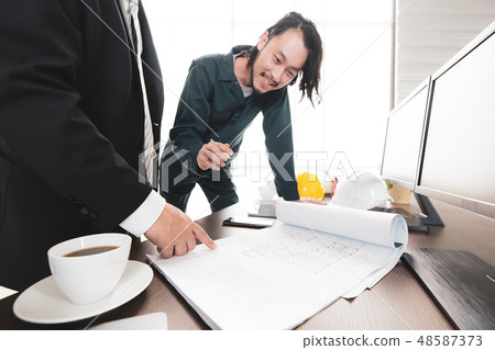 Young engineer cunsulting with senior. Young engineer cunsulting with senior. 48587373