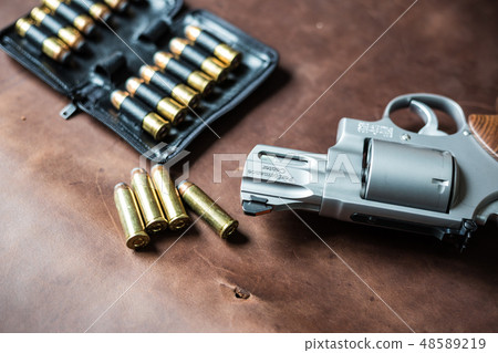 .44 magnum jacket soft point bullet on leather 48589219