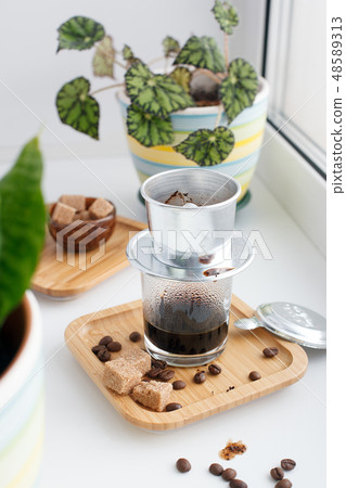 Hot coffee dripping in Vietnam style, minimal Hot coffee dripping in Vietnam style, minimal 48589313