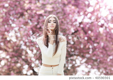 Fashion Art Beauty Portrait. Beautiful Girl in Fantasy Mystical and Magical Spring Garden. Model 48590301