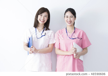 Medical image Two women in white dress 48590606