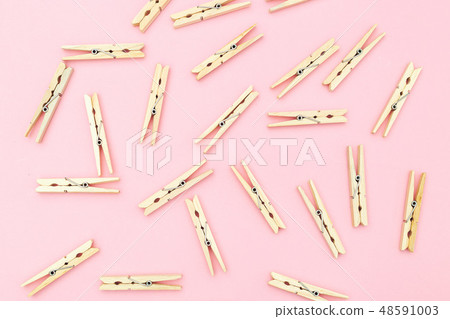 Wooden clothes pegs on pink background. Zero waste Wooden clothes pegs on pink background. Zero waste 48591003