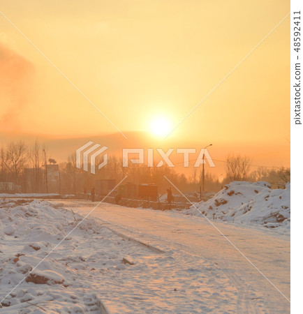 Road at winter sunset. Road at winter sunset. 48592411
