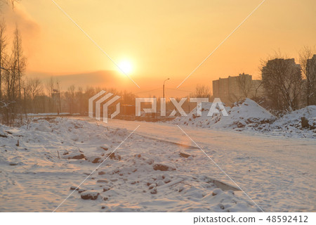 Road at winter sunset. Road at winter sunset. 48592412