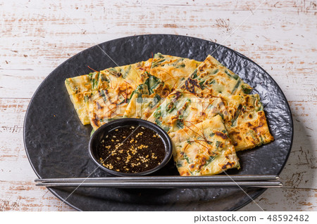 Chijimi Korean gourmet Asian Okonomiyaki jijim and iron pan Korean food Chijimi Korean gourmet Asian Okonomiyaki jijim and iron pan Korean food 48592482