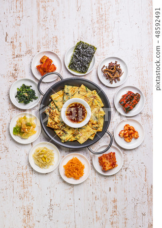 Chijimi Korean gourmet Asian Okonomiyaki jijim and iron pan Korean food Chijimi Korean gourmet Asian Okonomiyaki jijim and iron pan Korean food 48592491