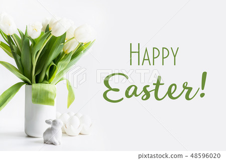 Easter. White tulips in vase, bunny, white eggse. Easter. White tulips in vase, bunny, white eggse. 48596020