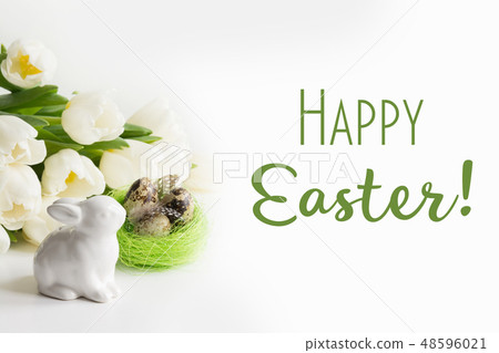 Easter concept. White tulips, nest, eggs on white. Easter concept. White tulips, nest, eggs on white. 48596021