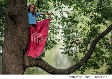 woman standing in yoga balance  48599538