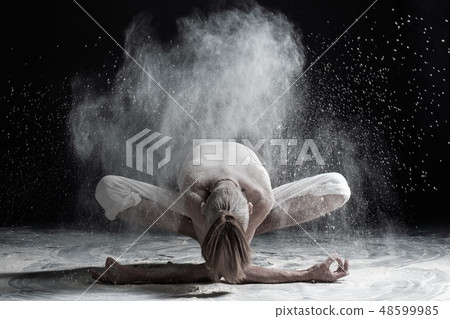 Young man practicing yoga Young man practicing yoga 48599985