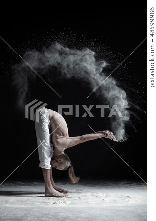 man in standing forward fold uttanasana man in standing forward fold uttanasana 48599986