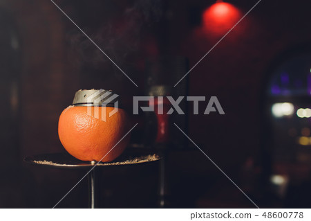 Luxury hookah with orange. Exotic bowl with fruit. Hookah lounge. Fruits and coals. Glamours relax 48600778