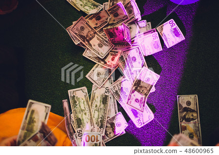 paper money in female hands on green background. paper money in female hands on green background. 48600965