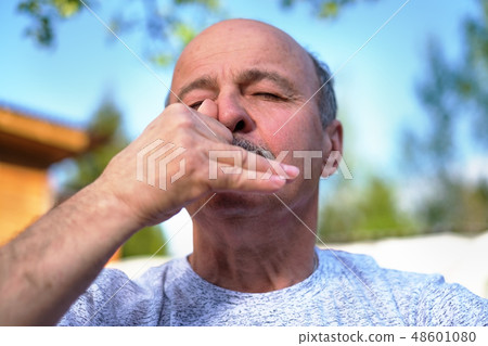 Handsome mature man breathing yoga pranayama 48601080