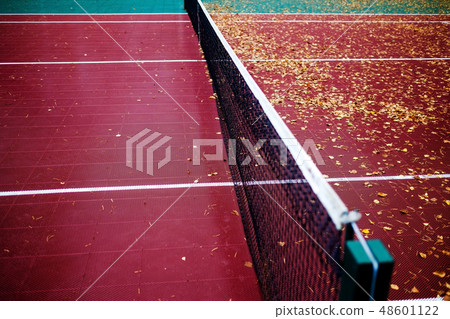 Empty plastic tennis court and net. 48601122