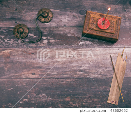 Burning an incense stick with copyspace on wood 48602662