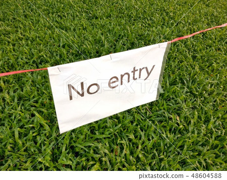 No entry sign on white paper in the green feild No entry sign on white paper in the green feild 48604588