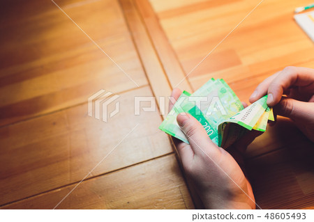 men's hands count the Russian money close up. men's hands count the Russian money close up. 48605493