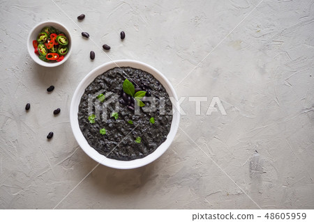Soup puree of black beans. Top view. Soup puree of black beans. Top view. 48605959
