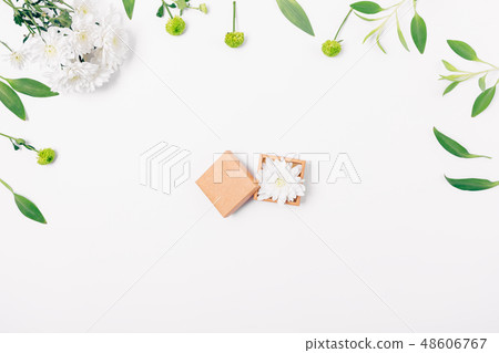 Flat lay floral arrangement of open small gift box Flat lay floral arrangement of open small gift box 48606767