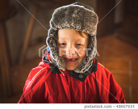 Little boy in snowsuit making funny expressions Little boy in snowsuit making funny expressions 48607035