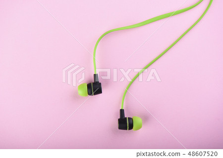 Green headphones or earphones isolated 48607520