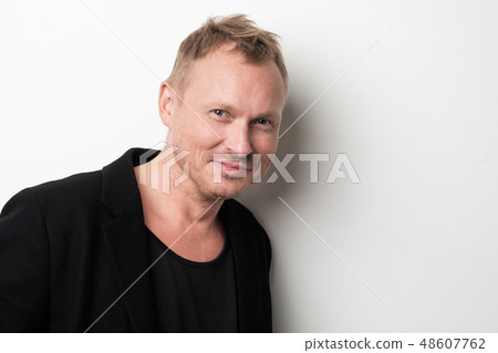 Smiling young man in black clothes 48607762