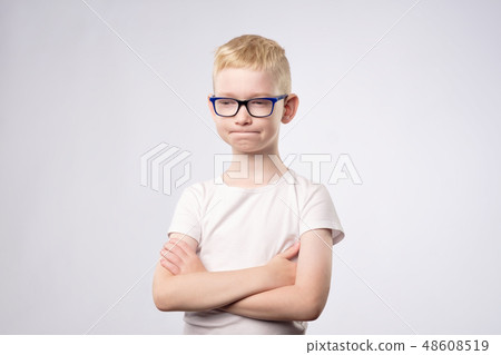 Boy with blond hair and glasses thinking Boy with blond hair and glasses thinking 48608519