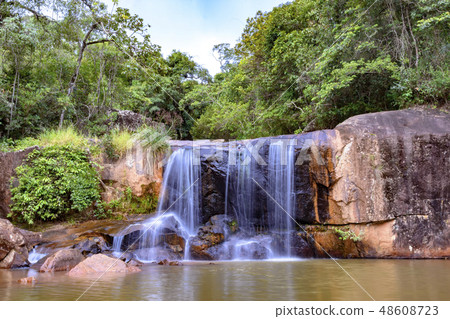 Cascade in the rain forest between stones Cascade in the rain forest between stones 48608723