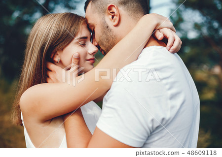 Beautiful couple spend time in a summer park 48609118
