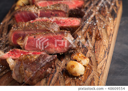 Closeup ready to eat steak new York. 48609554